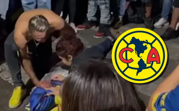 Fanático de cayó de un semáforo.